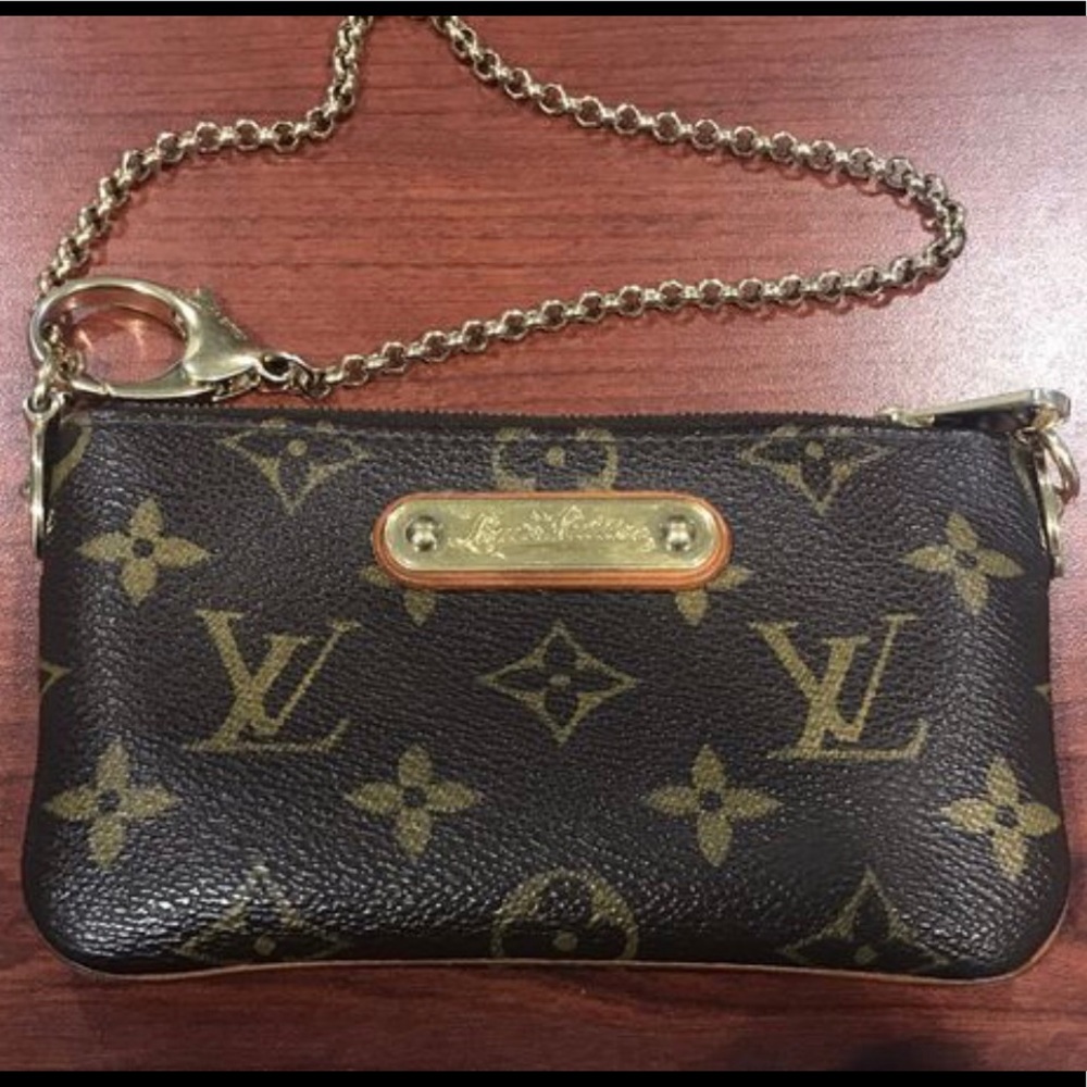 Pochette Milla PM monogram coated canvas Wristlet